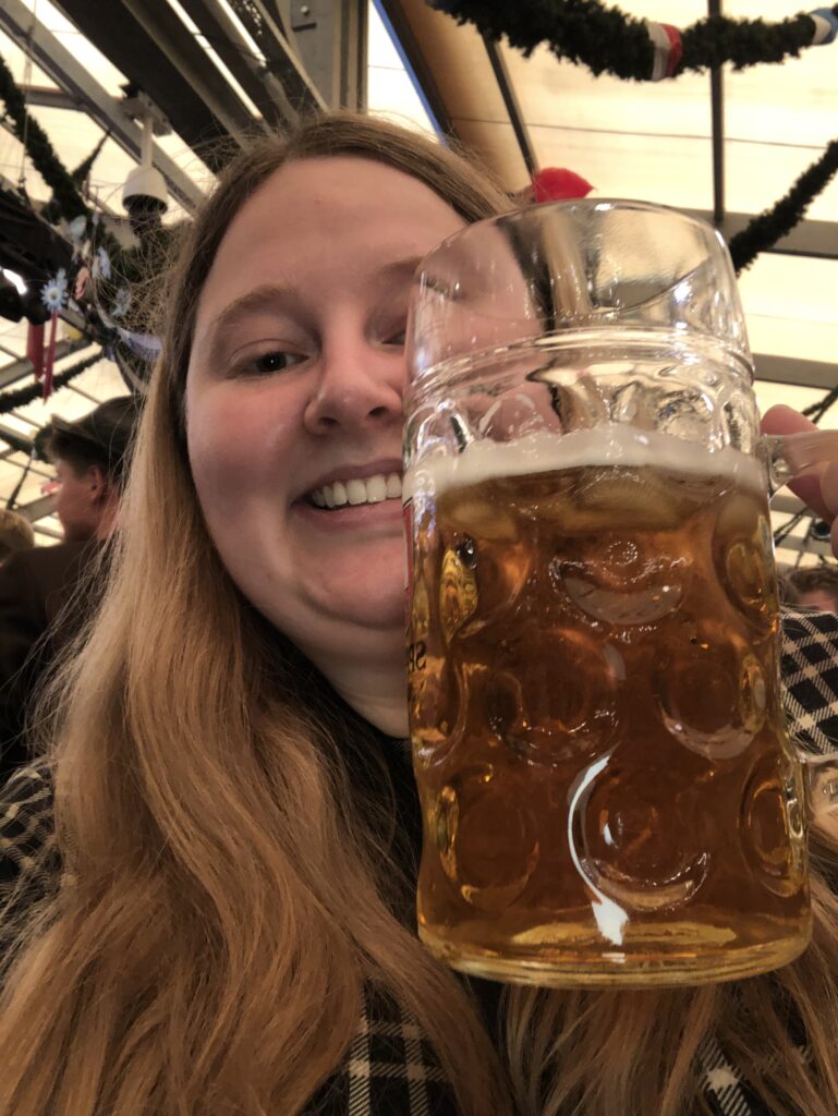 Woman drinking beer at Oktoberfest